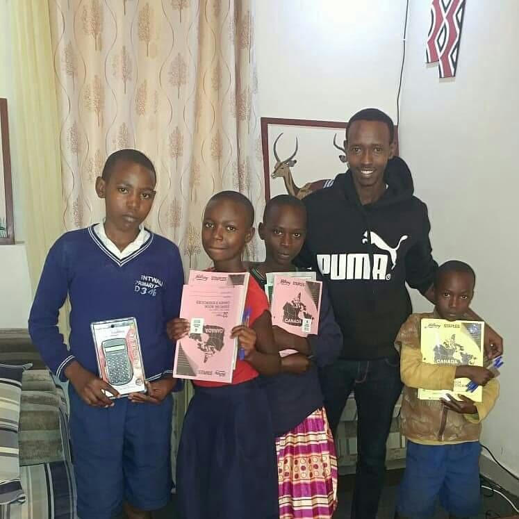 Maurice with four beneficiaries of Gira Ubumuntu